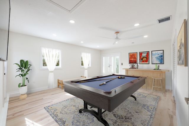 playroom with bar, ceiling fan, light hardwood / wood-style floors, and pool table