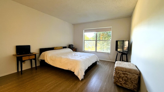 3650 Inverrary Dr Unit 3C, Lauderhill, FL 33319 - bedroom featuring dark wood-style floors, baseboards, and a textured ceiling