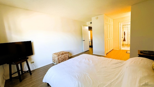 3650 Inverrary Dr Unit 3C, Lauderhill, FL 33319 - bedroom with wood finished floors, baseboards, and ensuite bathroom