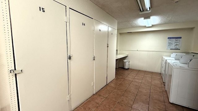 3650 Inverrary Dr Unit 3C, Lauderhill, FL 33319 - communal laundry room with washing machine and clothes dryer, wainscoting, light tile patterned floors, and a textured ceiling