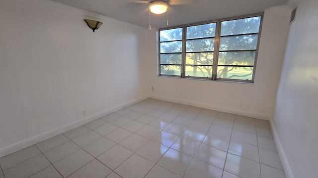 spare room featuring light tile patterned flooring