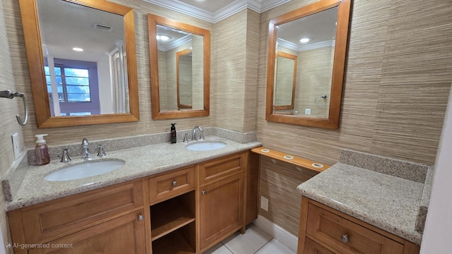 bathroom featuring tile patterned flooring, vanity, and ornamental molding