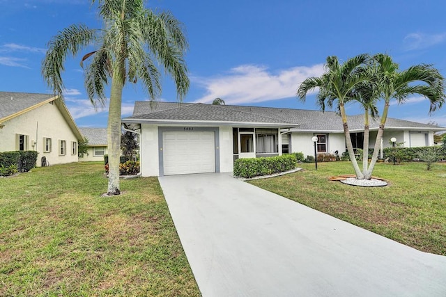 ranch-style home featuring a garage and a front yard