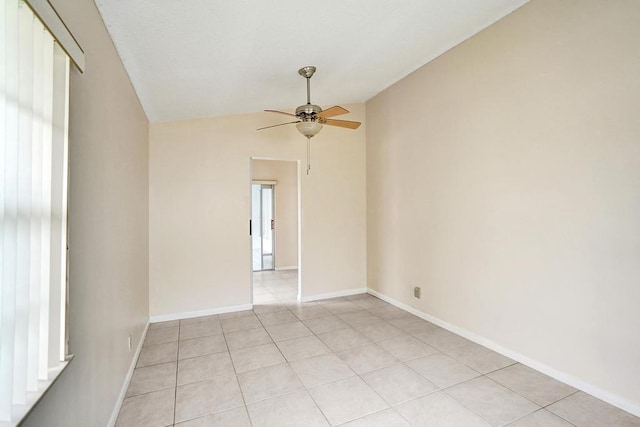 tiled spare room with ceiling fan and lofted ceiling