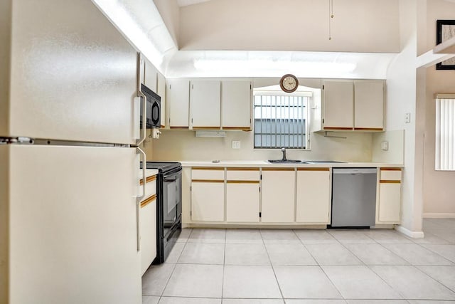 kitchen with black range with electric cooktop, sink, light tile patterned floors, white refrigerator, and dishwasher