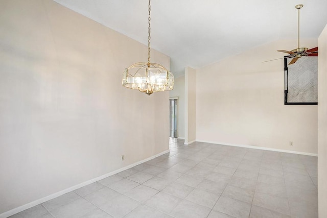 empty room featuring light tile patterned floors, ceiling fan with notable chandelier, and vaulted ceiling