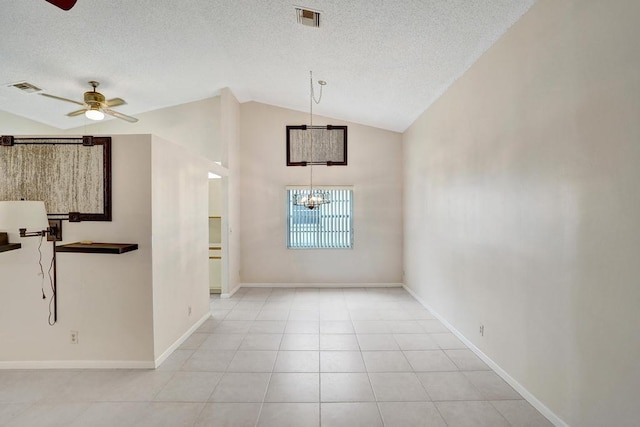 interior space featuring ceiling fan with notable chandelier, a textured ceiling, and vaulted ceiling