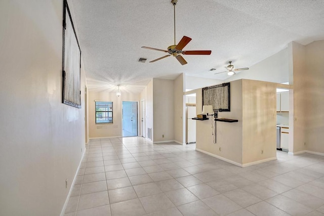 unfurnished living room featuring light tile patterned floors, a textured ceiling, high vaulted ceiling, and ceiling fan