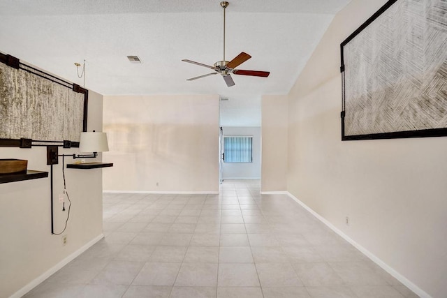 unfurnished living room featuring ceiling fan, light tile patterned floors, and high vaulted ceiling