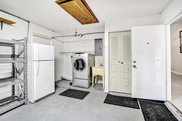 washroom with electric panel, sink, and washer / clothes dryer