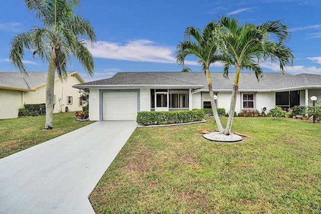 ranch-style home with a garage and a front yard