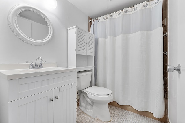 bathroom featuring tile patterned flooring, vanity, a shower with shower curtain, and toilet