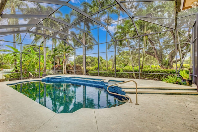 view of swimming pool with a lanai and a patio area