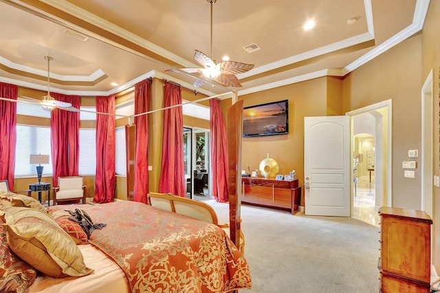 bedroom with carpet, ceiling fan, a raised ceiling, and ornamental molding