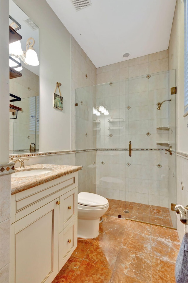 bathroom featuring vanity, toilet, and walk in shower