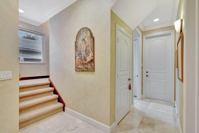 hallway featuring ornamental molding