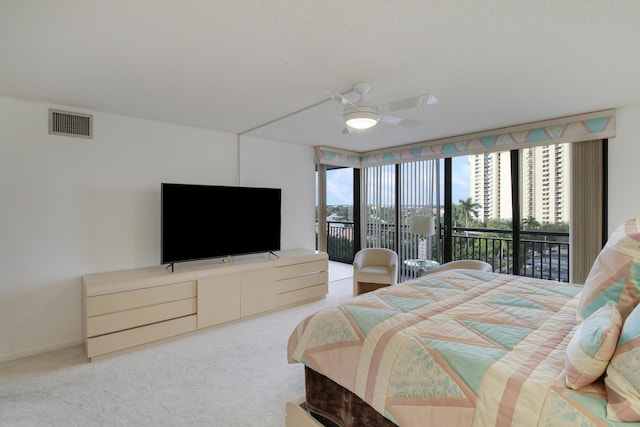 carpeted bedroom featuring access to outside and ceiling fan