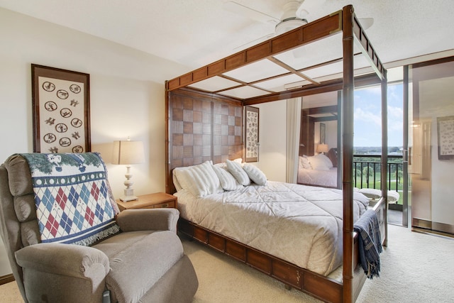 bedroom with carpet flooring, ceiling fan, expansive windows, and access to exterior