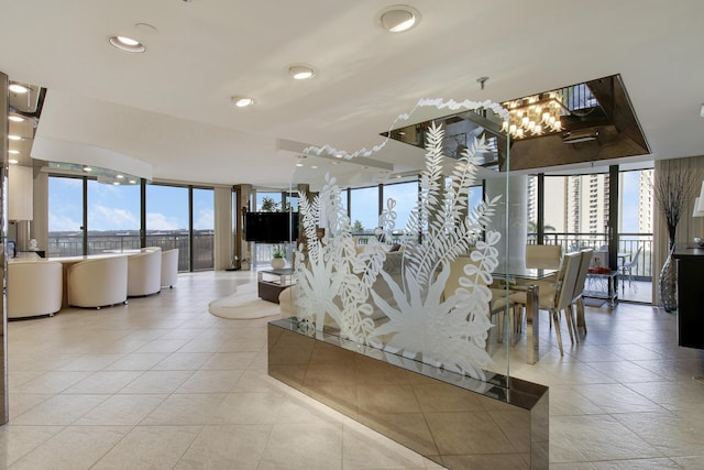 living room featuring light tile patterned floors and a healthy amount of sunlight