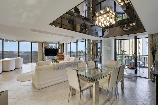 dining space with light tile patterned floors, expansive windows, a healthy amount of sunlight, and a notable chandelier