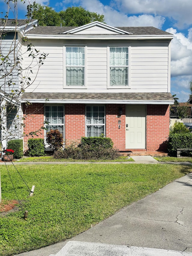 front of property featuring a front lawn