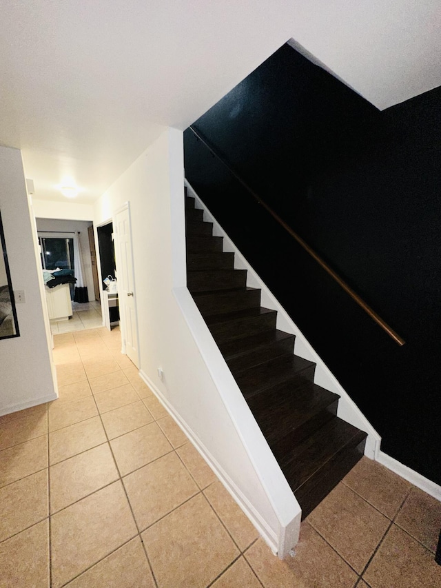 staircase with tile patterned flooring