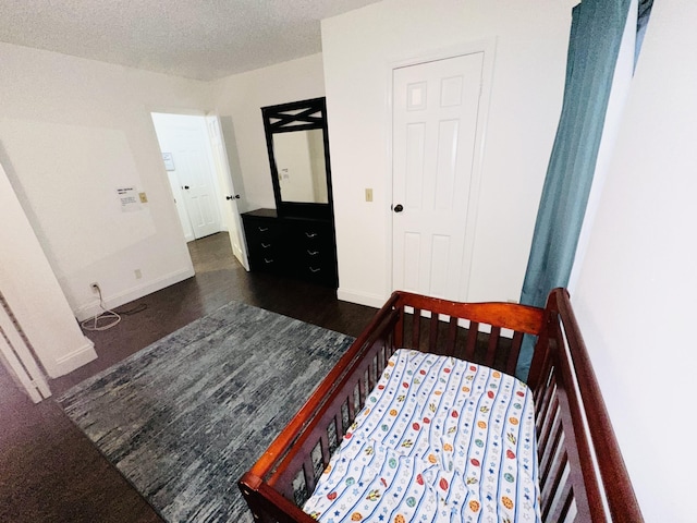 bedroom featuring a textured ceiling