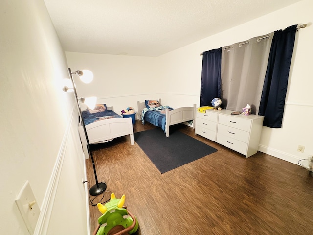 bedroom featuring dark hardwood / wood-style floors