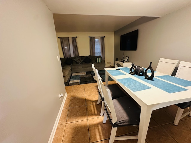 dining space featuring tile patterned flooring