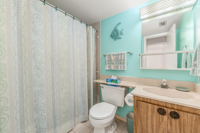 bathroom featuring tile patterned floors, vanity, and toilet