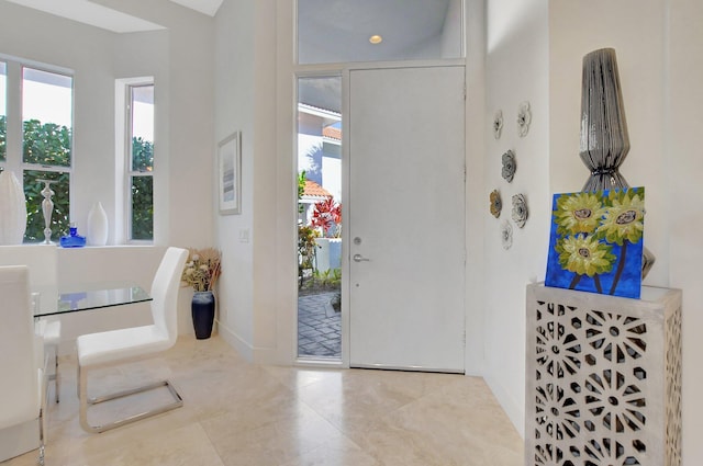 tiled entryway featuring a healthy amount of sunlight