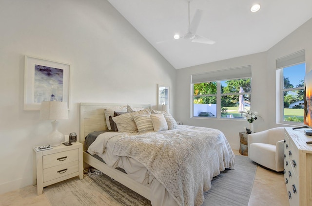 bedroom featuring ceiling fan and high vaulted ceiling