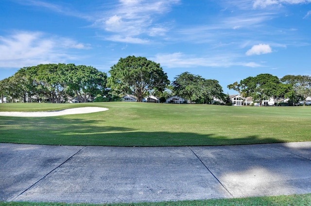 surrounding community featuring a yard