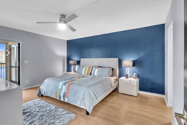 bedroom featuring light wood-type flooring and ceiling fan