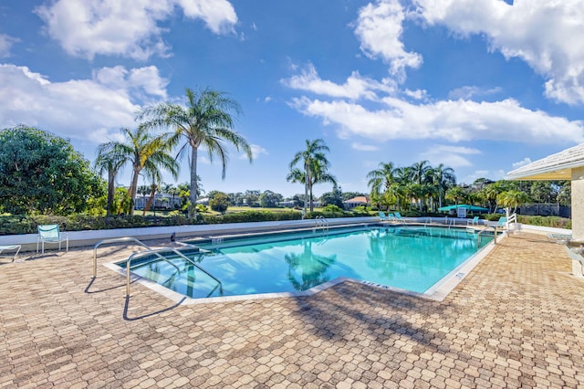 view of swimming pool featuring a patio