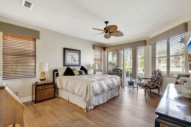 bedroom with hardwood / wood-style flooring and ceiling fan