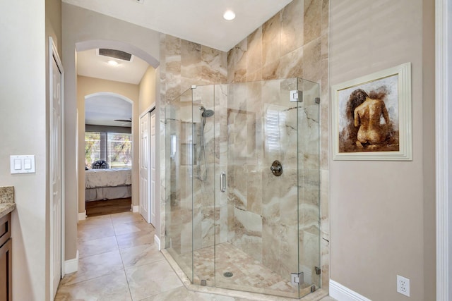 bathroom with an enclosed shower and vanity