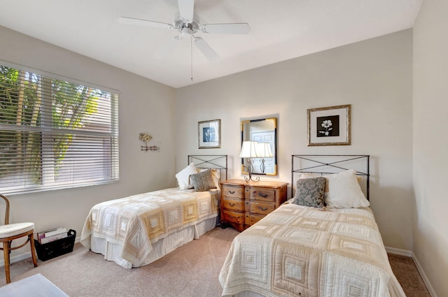 1935 SW Whitemarsh Way, Palm City, FL 34990 - bedroom with carpet flooring, baseboards, and a ceiling fan