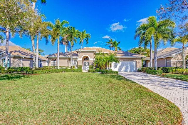 view of front facade with a garage and a front yard