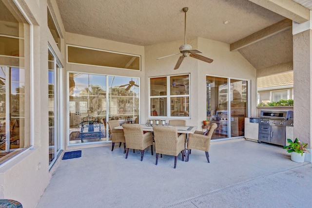 view of patio / terrace with an outdoor kitchen and ceiling fan