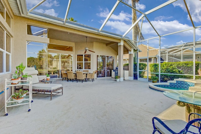 1935 SW Whitemarsh Way, Palm City, FL 34990 - sunroom / solarium featuring outdoor dining space, a ceiling fan, and healthy amount of natural light