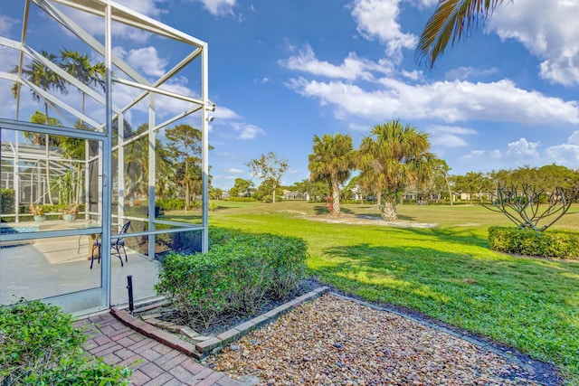 view of yard featuring a lanai