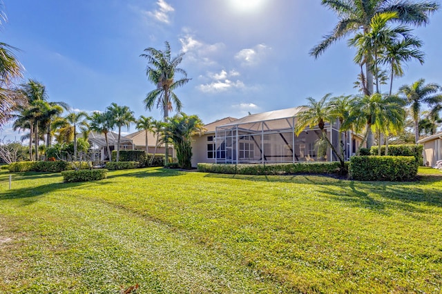 view of yard featuring glass enclosure