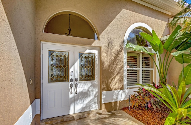 property entrance featuring french doors