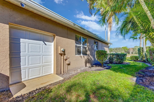 entrance to property featuring a yard