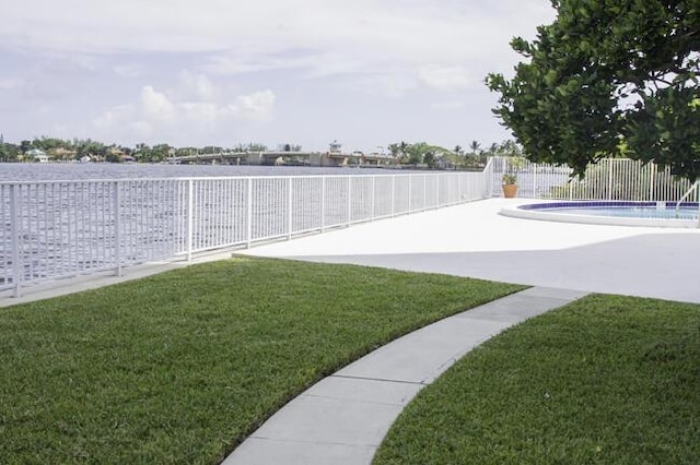 view of yard featuring a patio area and an empty pool