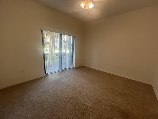 carpeted empty room featuring ceiling fan