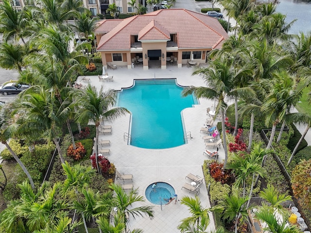 community pool with a patio area