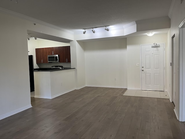 kitchen featuring wood-type flooring, a textured ceiling, rail lighting, and ornamental molding