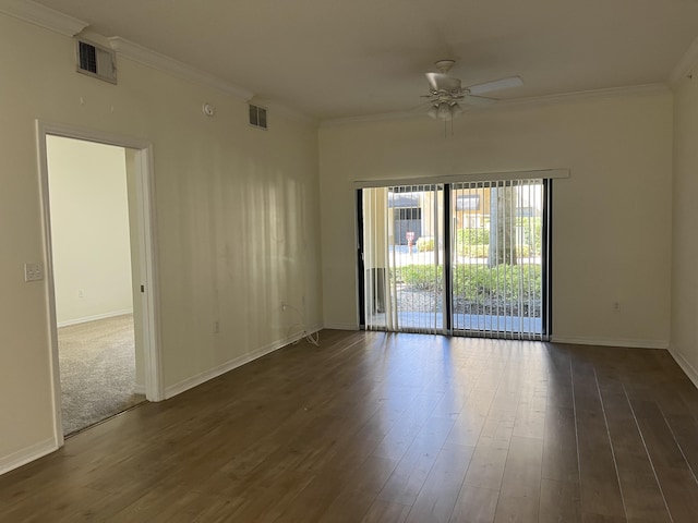 spare room featuring crown molding, ceiling fan, and dark wood-type flooring